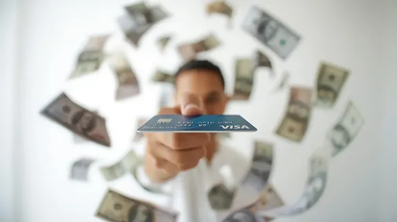 Man holding debit card with cash. AI-generated with Canva Man holding debit card with cash. AI-generated with Canva